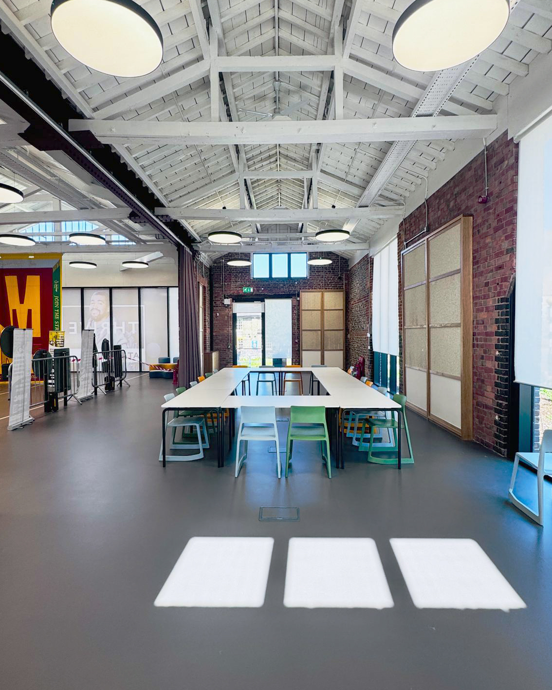 Commercial dark grey sustainable resin floor with table and chairs