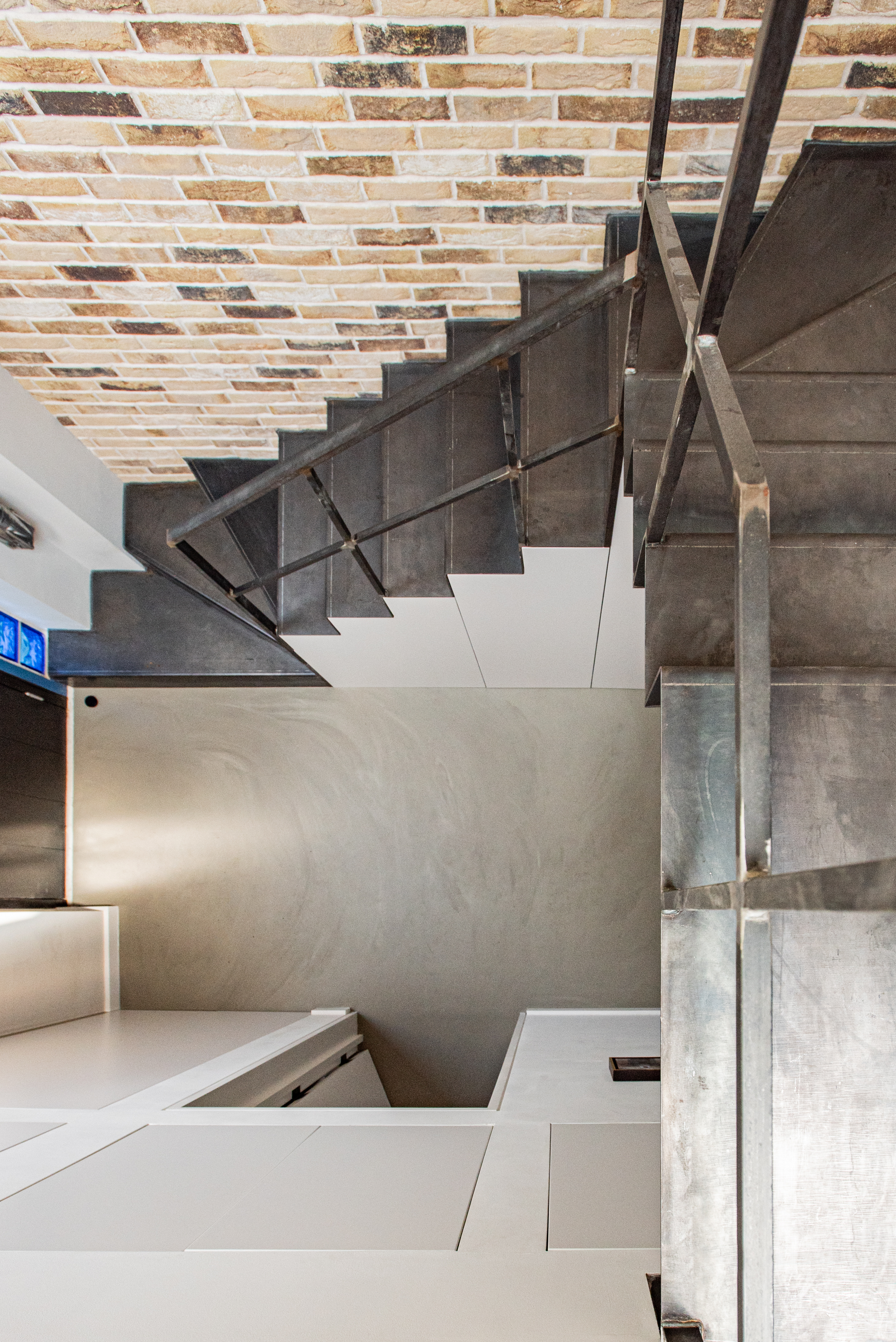 Sustainable resin flooring in a hallway with stairs
