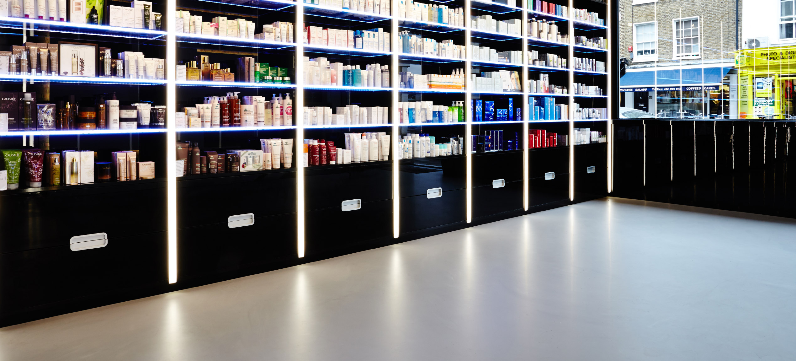 Beauty clinic with light grey resin floors