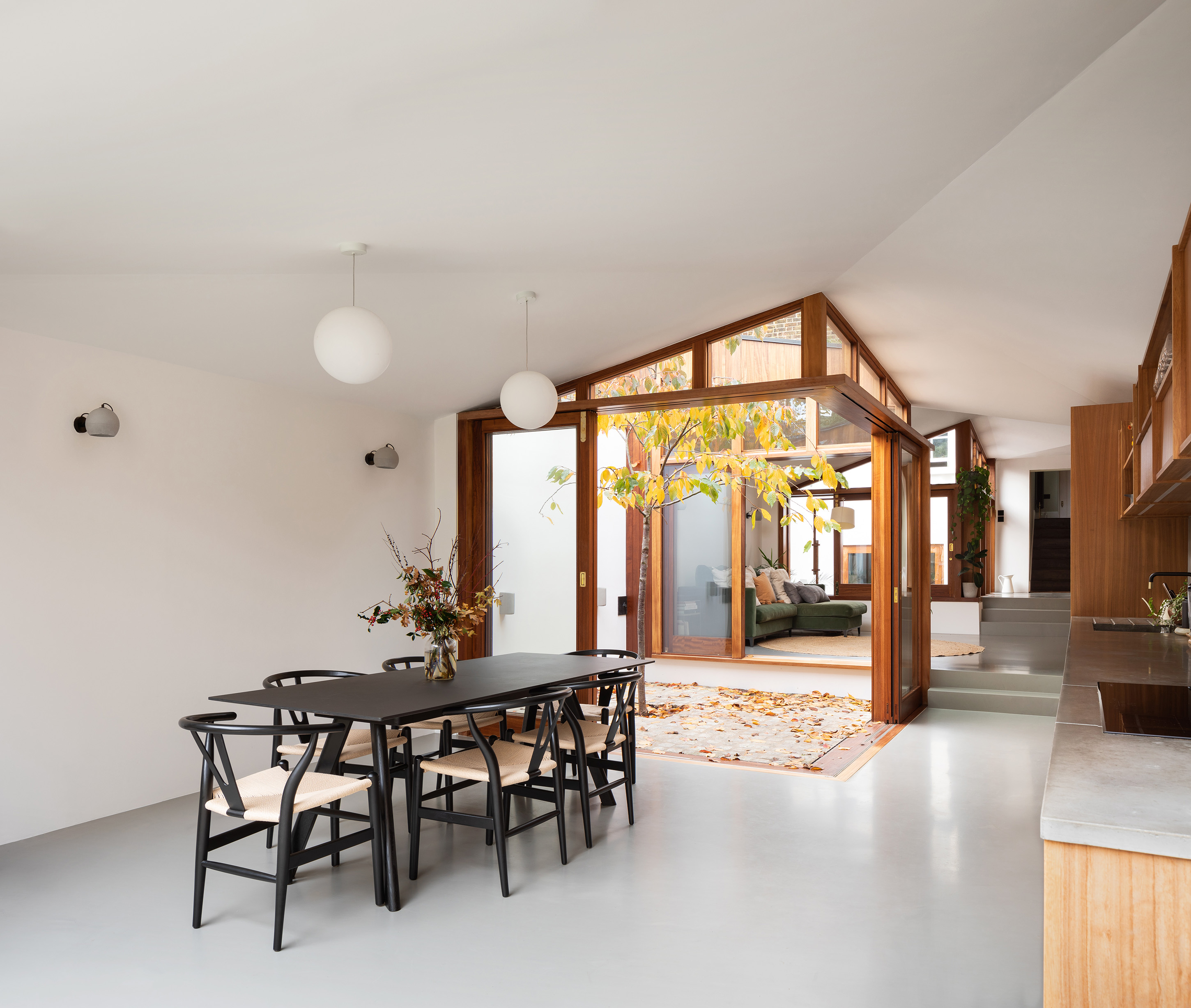 Grey resin dining room floor with black dining table