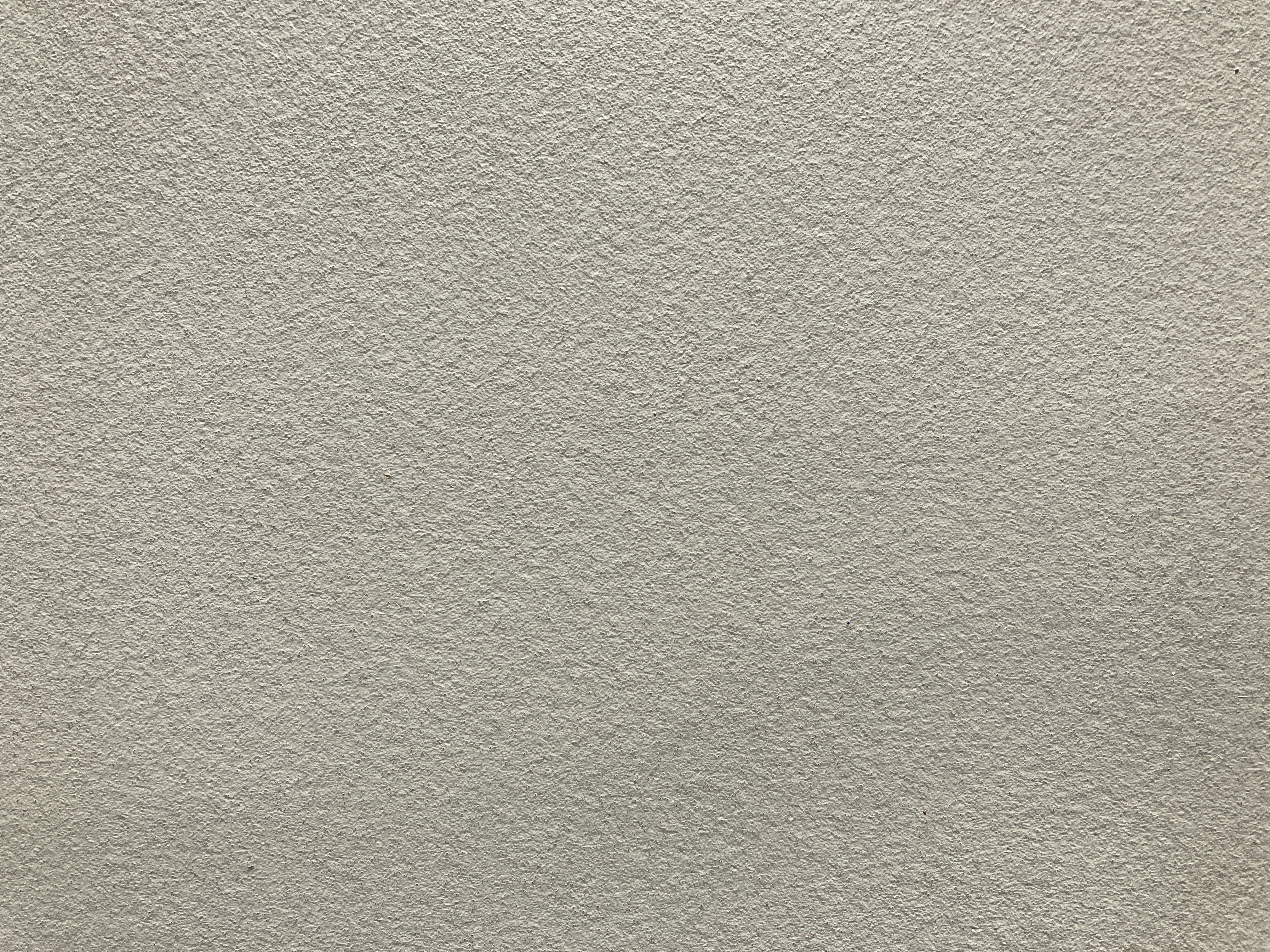 Close up shot of resin floor in beige colour, texture imitating micro-cement