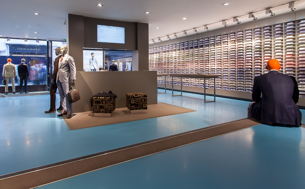 A blue resin floor in a suit shop