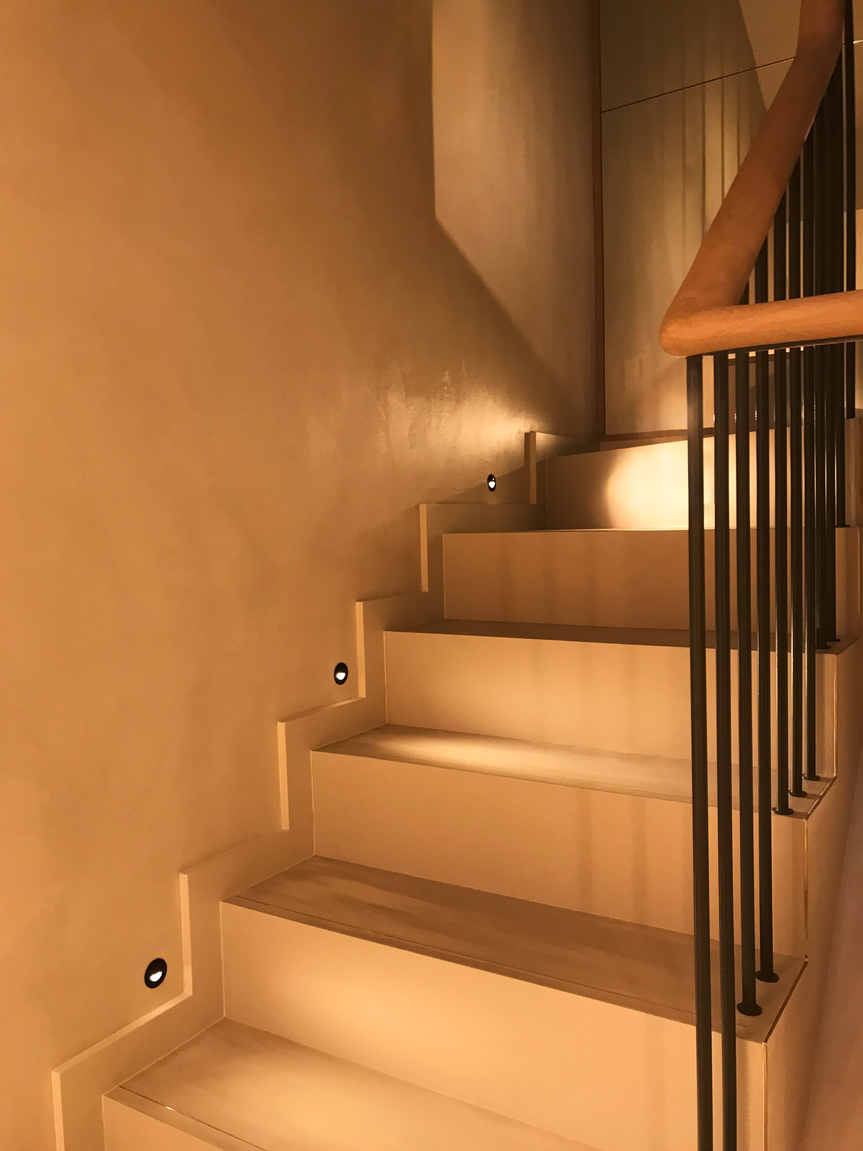 Steps with matching resin floors and walls in orange lighting