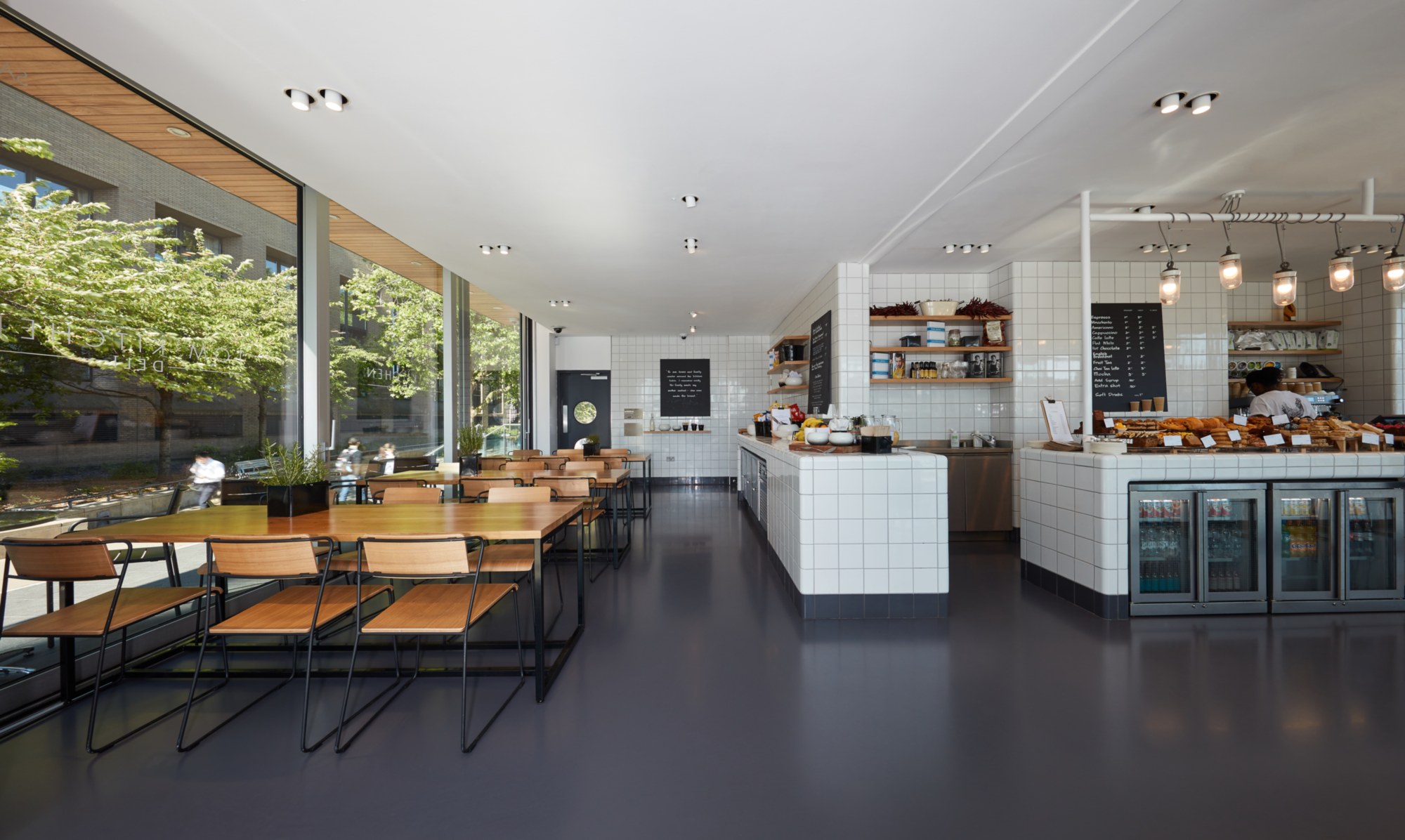 Dark grey commercial resin flooring in a restaurant environment