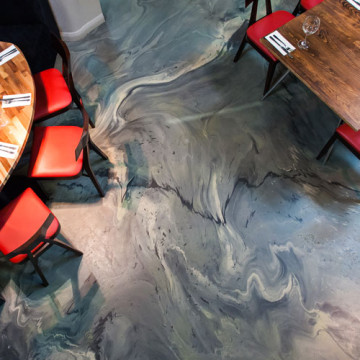 Grey commercial resin floor in a restaurant