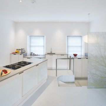 White residential resin floor in a kitchen with white interiors
