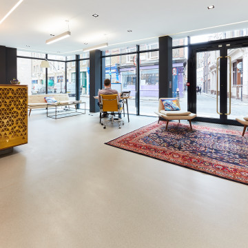 Grey commercial resin terrazzo flooring in an office