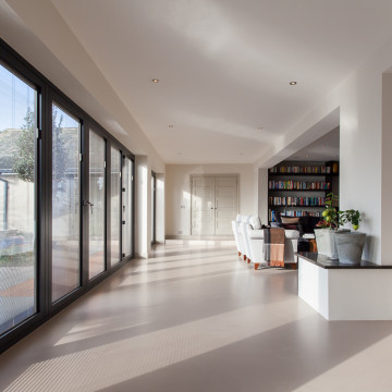 Grey sustainable resin flooring in a kitchen room