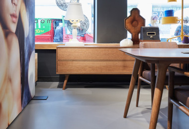 a grey resin floor in a showroom