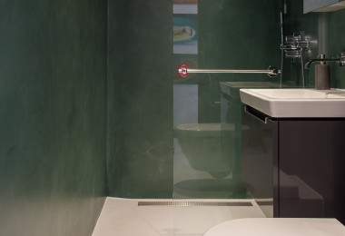 Green walled bathroom with anti slip resin floor