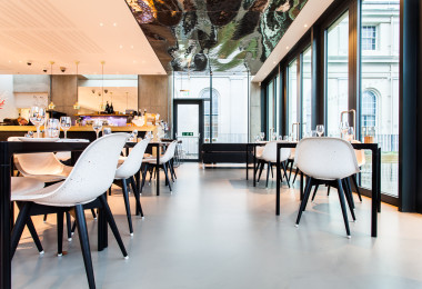Grey commercial resin flooring in a restaurant