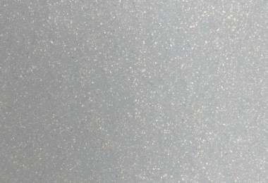 Light grey sustainable resin floor close up with light aggregate