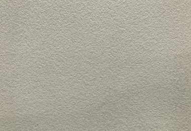 Close up shot of resin floor in beige colour, texture imitating micro-cement