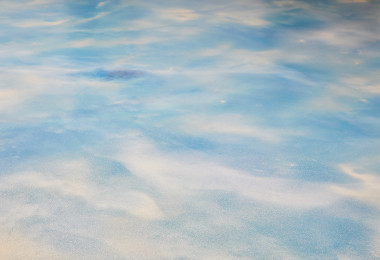 A light blue resin floor with white running through it