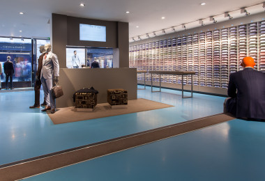 A blue resin floor in a suit shop