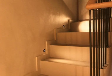 Steps with matching resin floors and walls in orange lighting