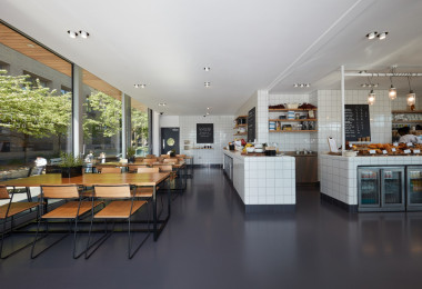 Dark grey commercial resin flooring in a restaurant environment