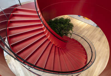 Red resin floor on a winding staircase with LED light edges