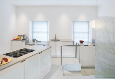 White kitchen resin floors and walls with white countertops