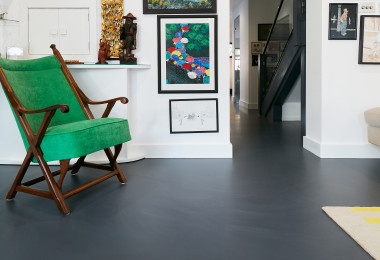 a dark grey resin floor in a living room