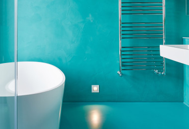 Turquoise matching bathroom resin floors and walls