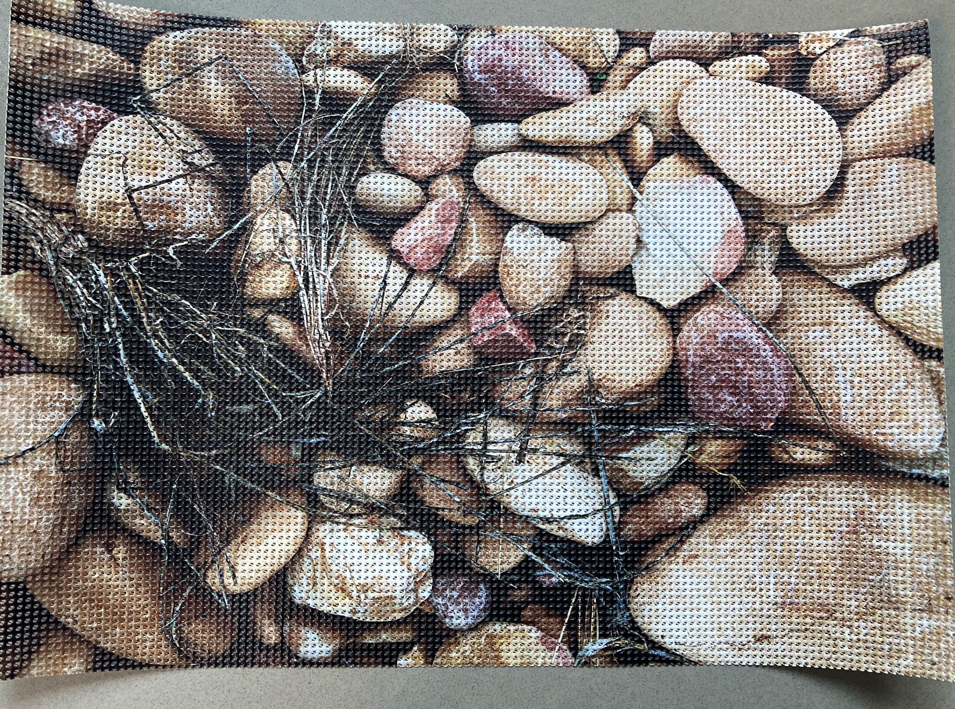 A pebble look mesh square to go into a patterned resin floor