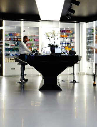 Beauty clinic with light grey resin floors