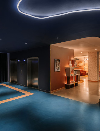 Electric blue resin floor with a rectangle beige detailing on the far left side