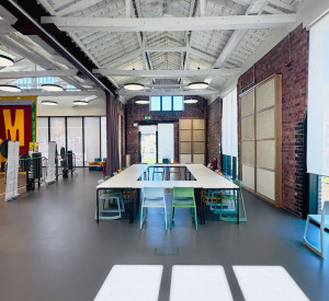 Commercial dark grey sustainable resin floor with table and chairs