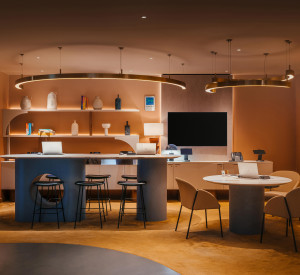 A reception desk with carpet and a seamless grey resin floor 