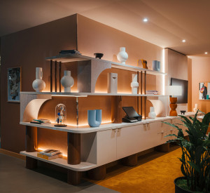 Hotel display shelf behind the reception desk, showing the blue and grey resin floors