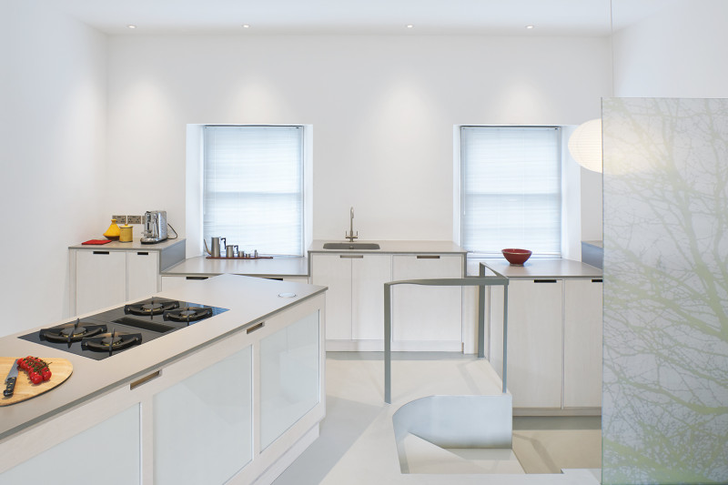 White residential resin floor in a kitchen with white interiors