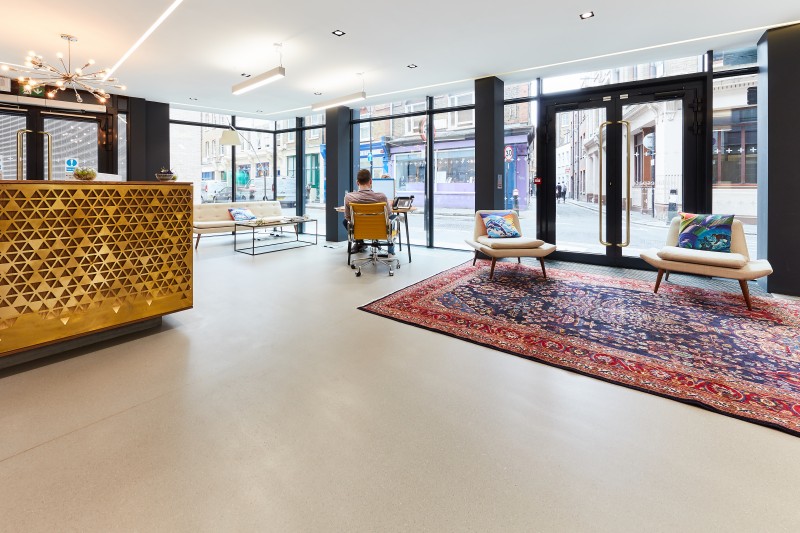 Grey commercial resin terrazzo flooring in an office