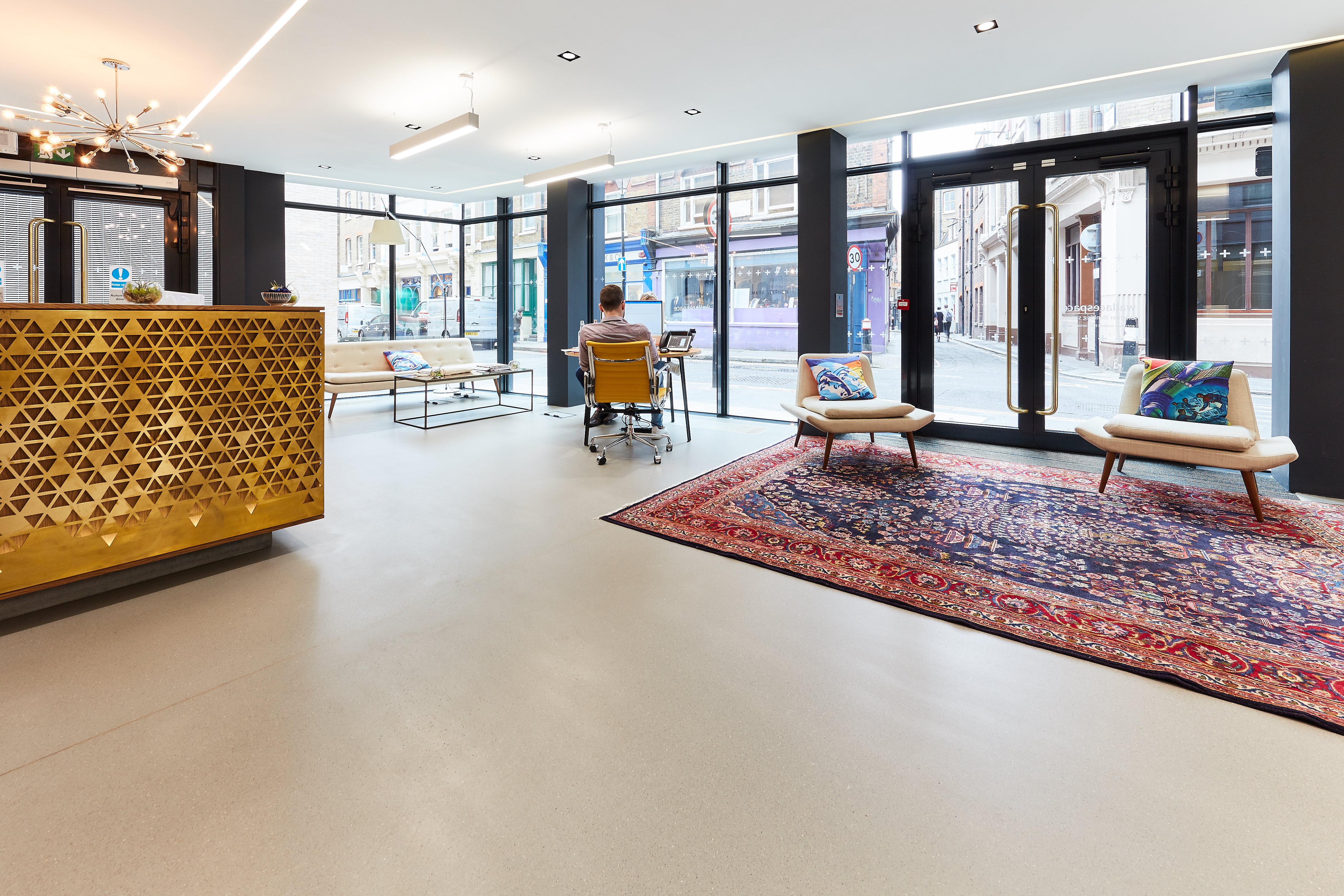 Grey commercial resin terrazzo flooring in an office