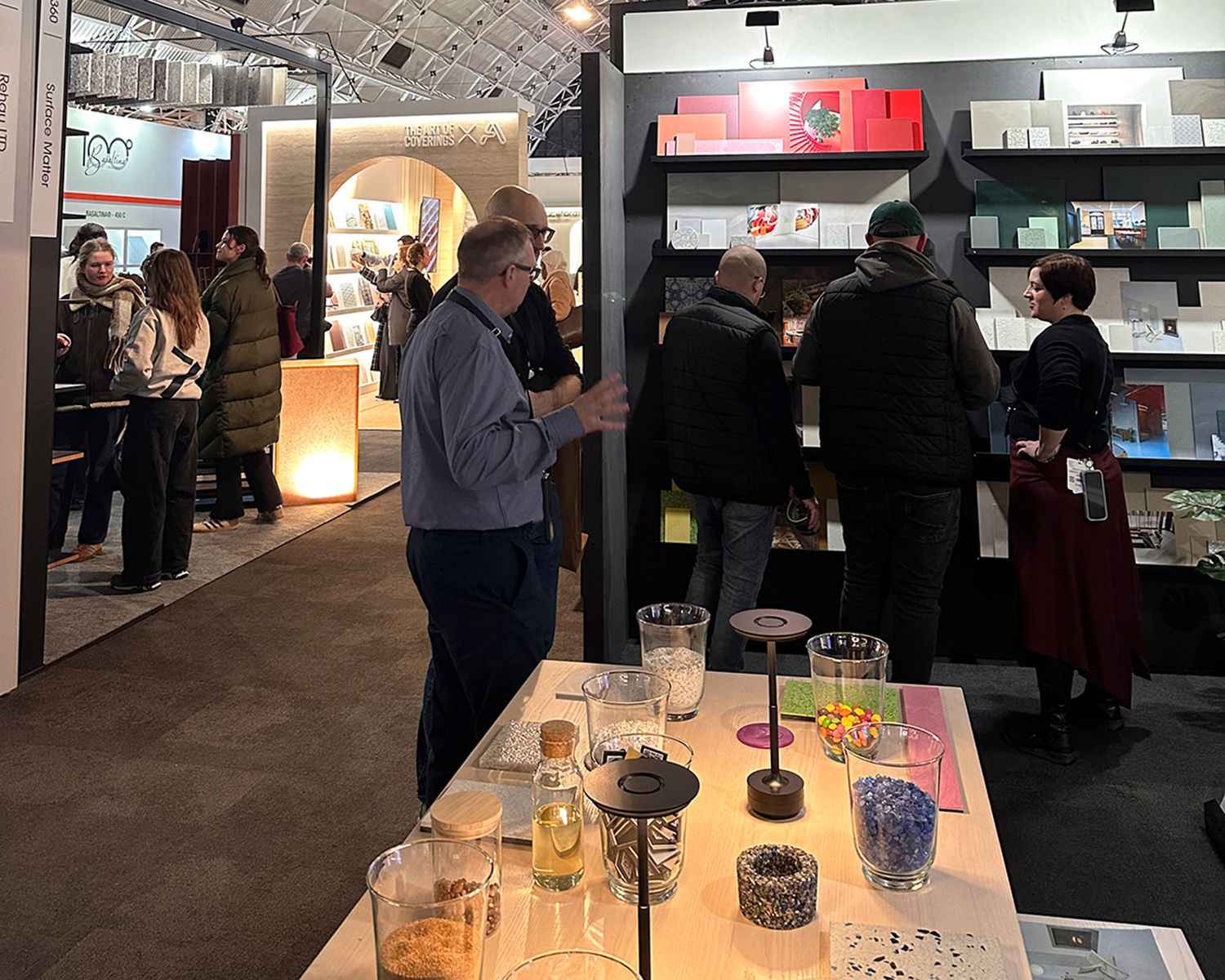 people chatting on resin floor and walls stand