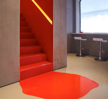 A ToughSphere resin floor in grey and red