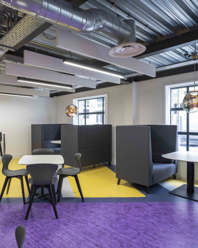 A purple and yellow designsphere floor in a seating area
