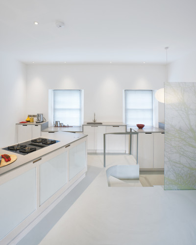 White residential resin floor in a kitchen with white interiors