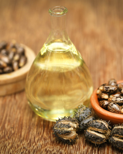 A pot of sustainable resin made with castor bean oil from the bowl of castor beans
