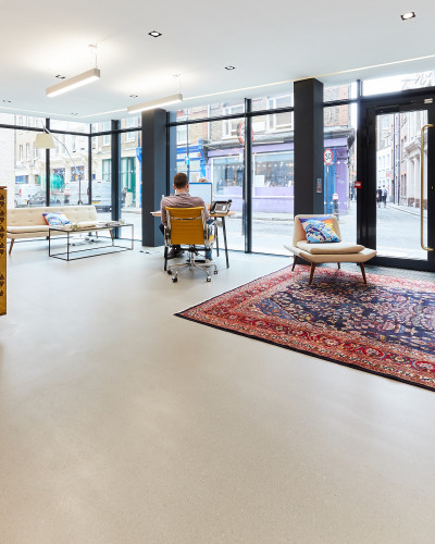 Grey commercial resin terrazzo flooring in an office
