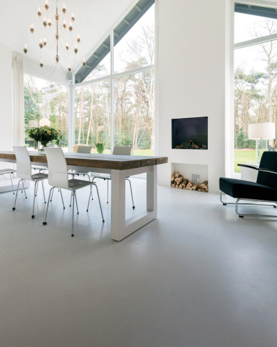 Grey sustainable resin flooring in a dining room