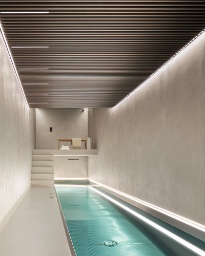 Basement swimming pool with seamless resin floors and walls, imitating polished concrete